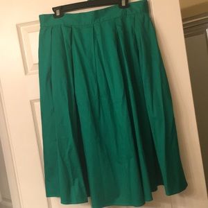Green pleated skirt